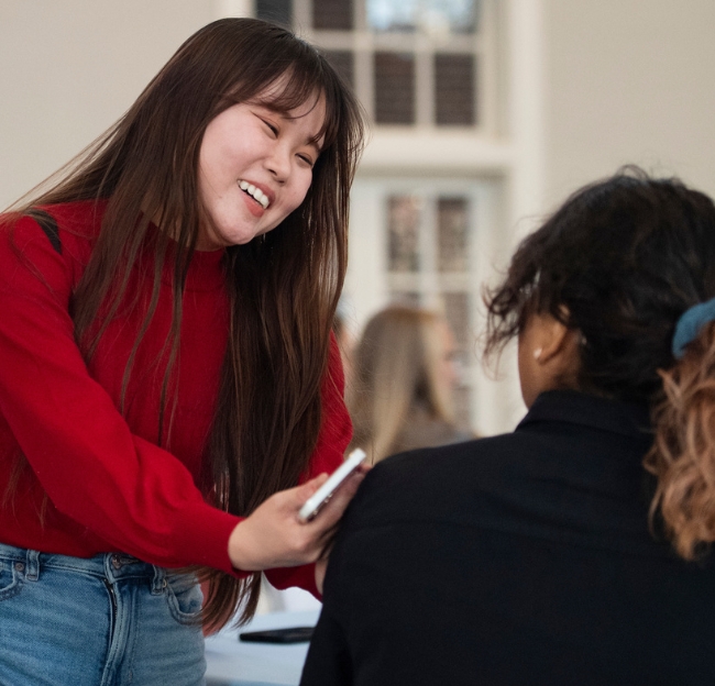 An international student talks with a peer at a Study Abroad event