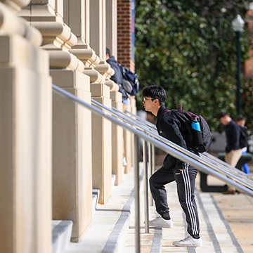 student walking up stairs