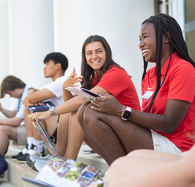 orientation leaders smiling outside the lyceum