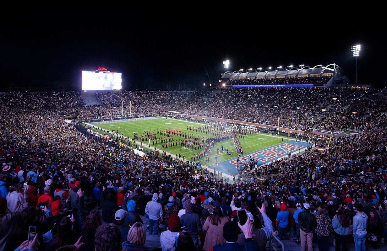 Fans light up Vaught-Hemingway Stadium with their cell phones as the band plays prior to the start of an Ole Miss football game under the lights.