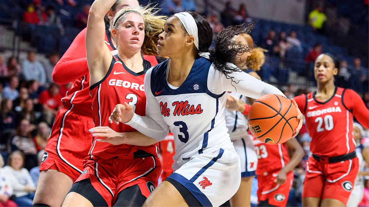 An Ole Miss women's basketball player makes a drive to the basket.