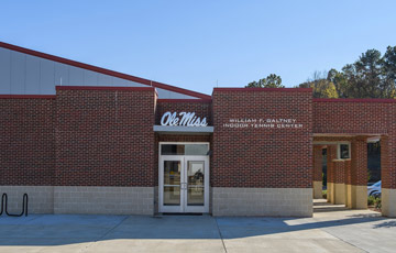 Brick exterior and doorway of the Galtney Indoor Tennis Center.