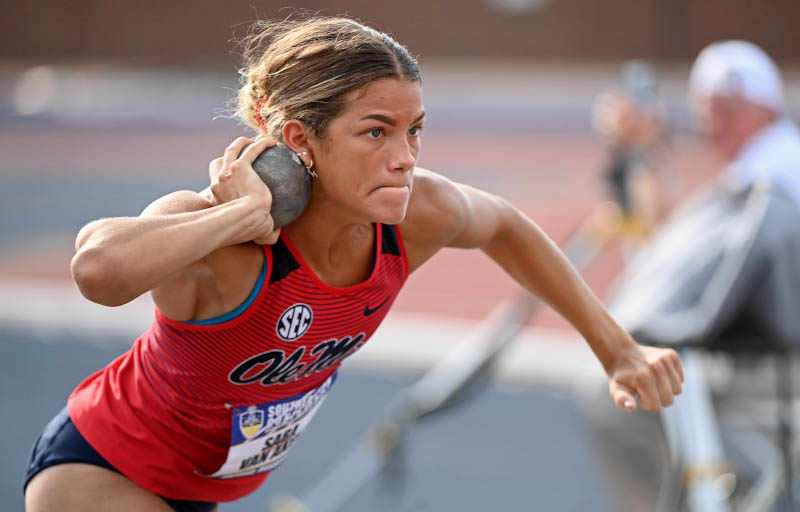 Woman throwing the shot put