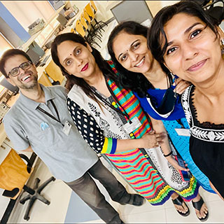 Stefali Pawar surrounded by her academic colleagues at the University of Mississippi