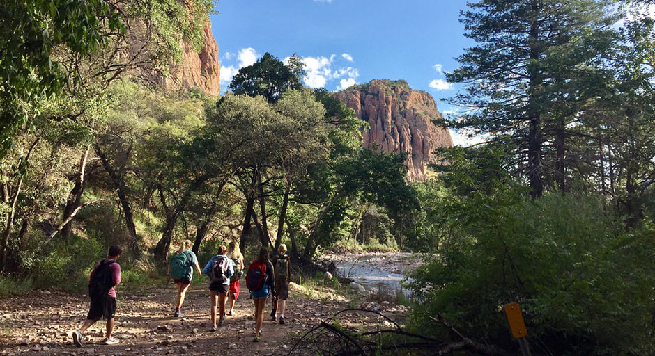 students walking through an Arizona mountain canyon