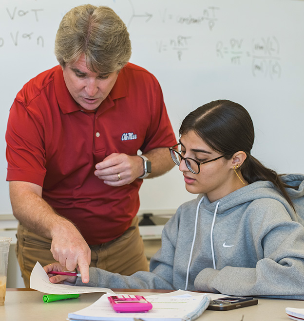 male teacher talking to a female student