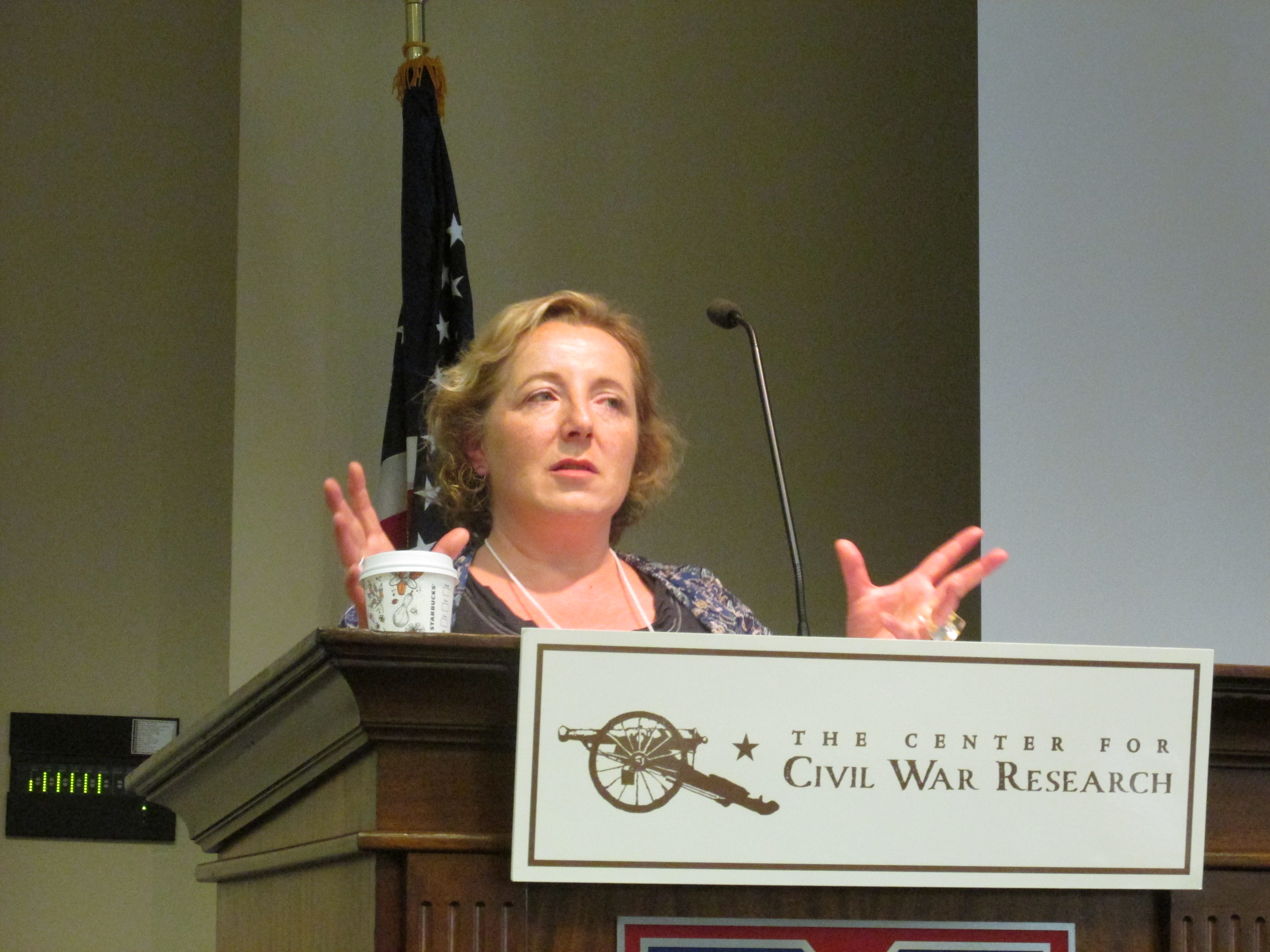 woman speaking at podium