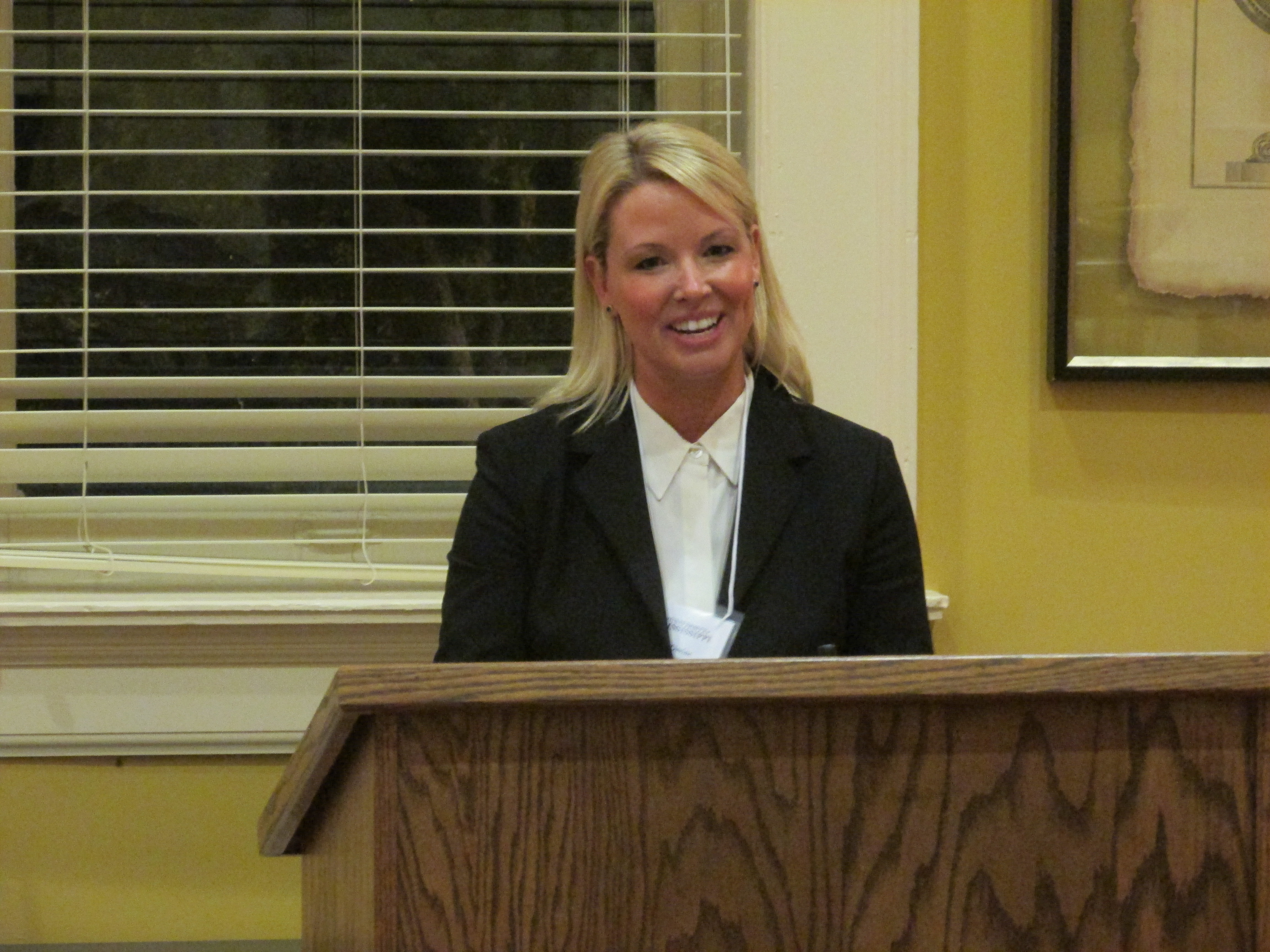 woman speaking at a podium