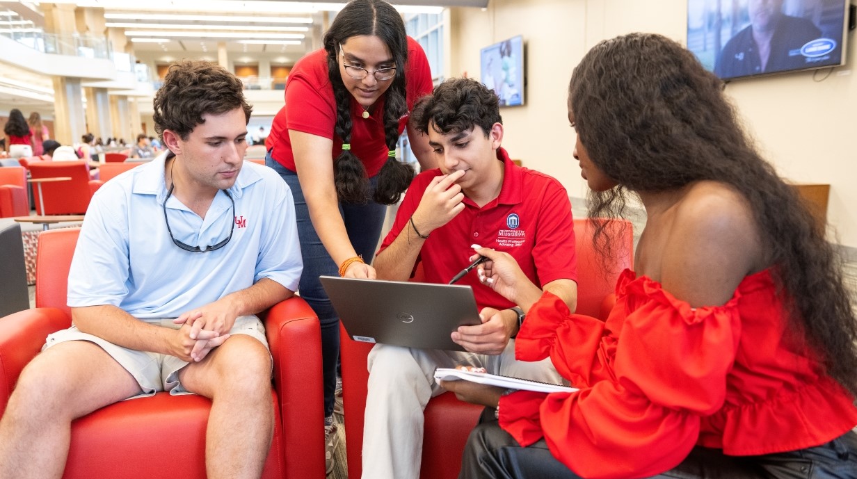 small group of students seated together in the Union studying