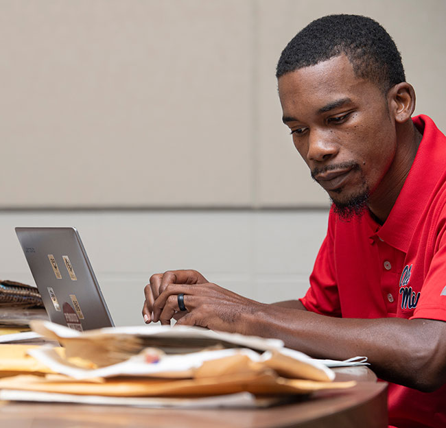 student looks at historical documents