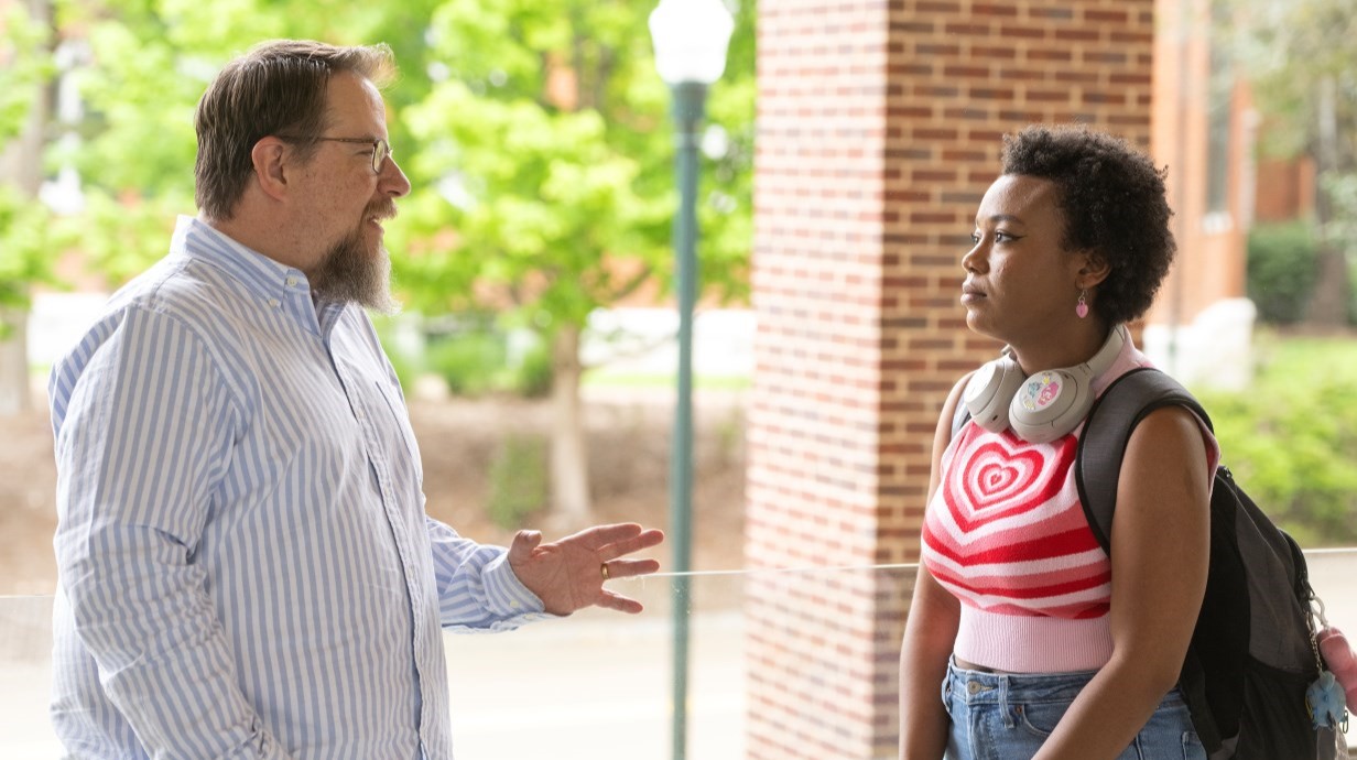 image of director talking with a student