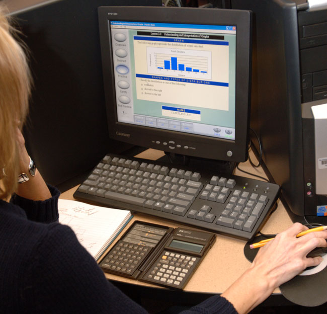 student working on a computer in the math lab
