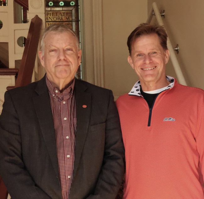 photo of Don Dyer and Allen Clark standing together on a stairwell