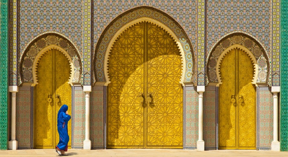 yellow doors of a mosque with many decorative details