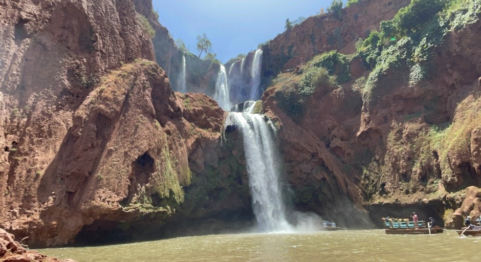 waterfall into a lake in a desert environment