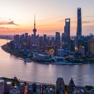 aerial view of Shanghai city, including tall buildings and a river