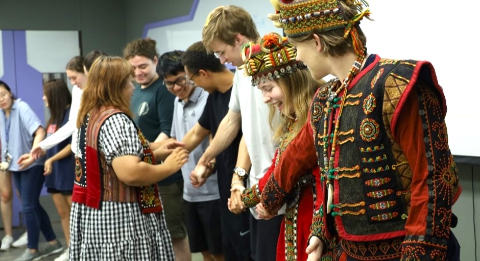 image of students in traditional costumes standing in a row