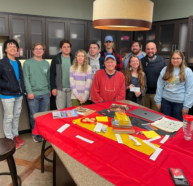 a group of students gathered together in a casual dining area