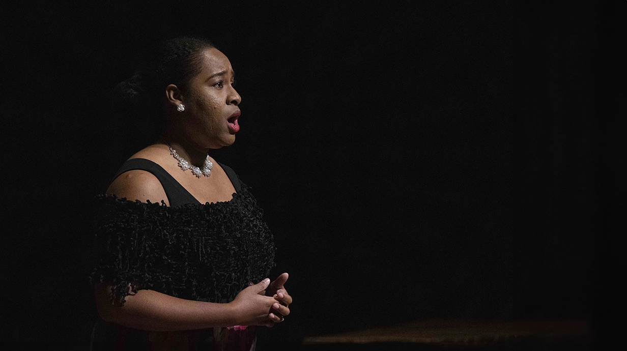 women singing on stage