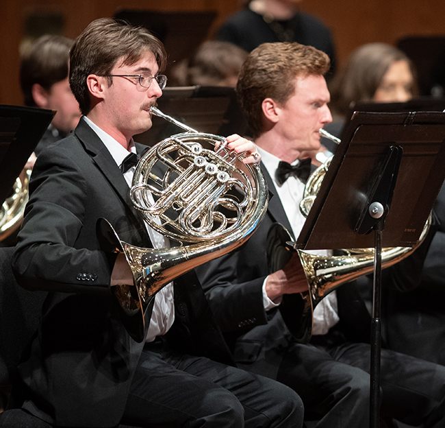 Band members perform in concert