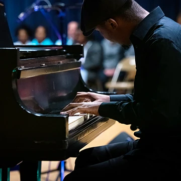 A student plays the piano