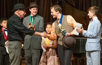 Kelton Boblits, 2019 Junior Division Champion receives his trophy from the judges