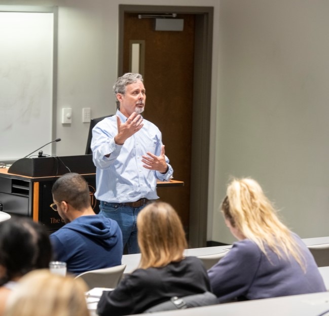 faculty member teaching in a classroom.