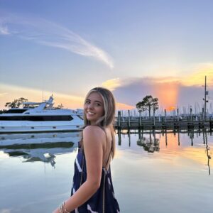 Abby Wagner in front of boats and water