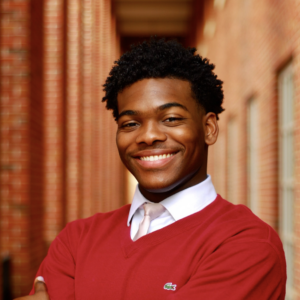 david smith portrait outside, standing in front of brick building
