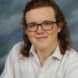 Elias Addy portrait with light blue background