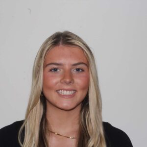 portrait of Paige Thorson against white wall