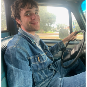 Turner Wolffe sitting in old truck driver's seat