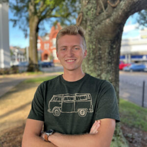 Walker Bray portrait; arms crossed outdoors