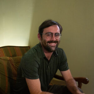 portrait of Wayne Dowdy sitting on couch