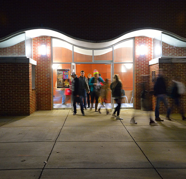 students walking out of meek auditorium