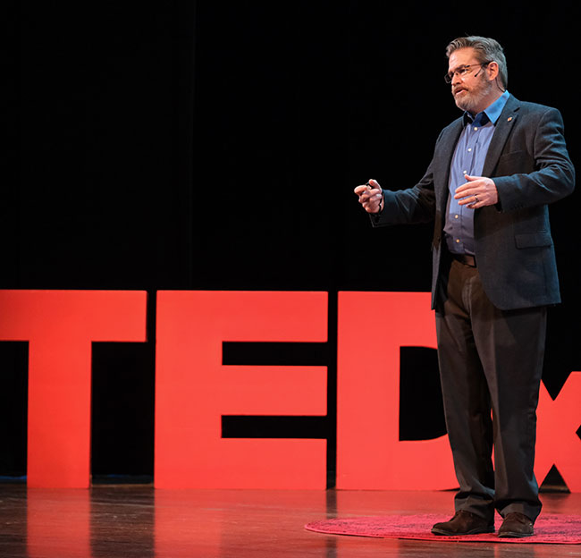 man giving ted talk