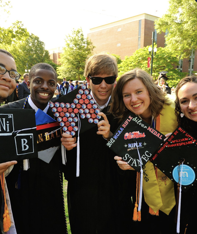 group of students smiling at graduation