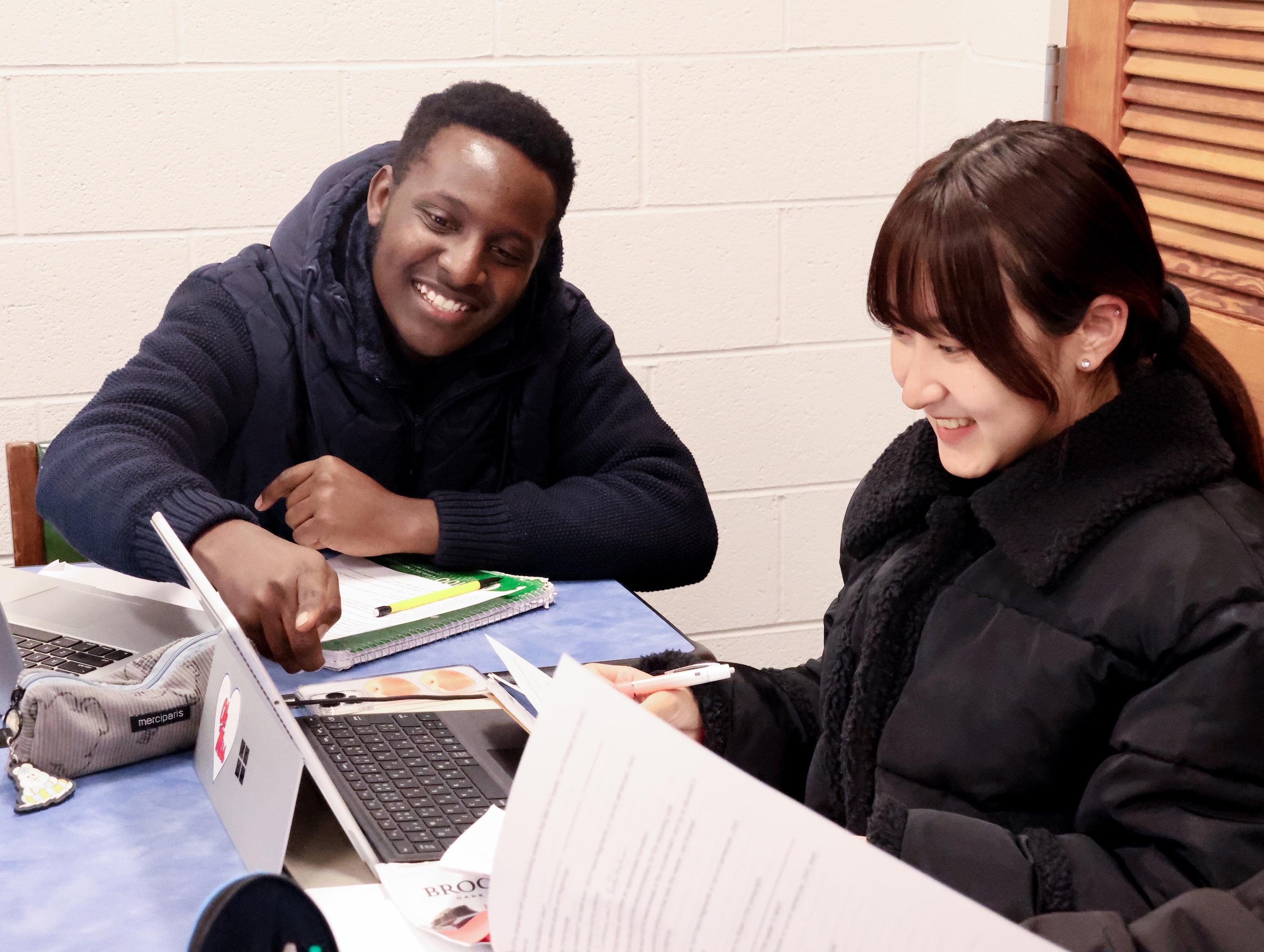 intensive English students smile during class