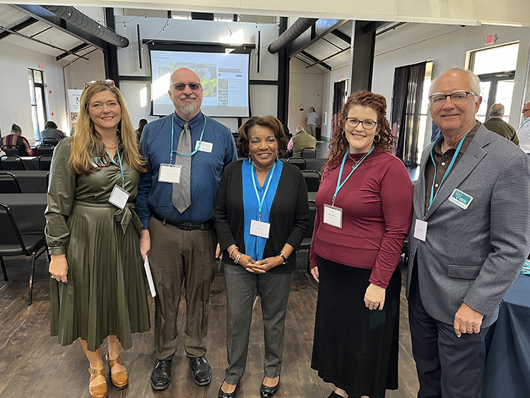 Broadband outreach participants smile.