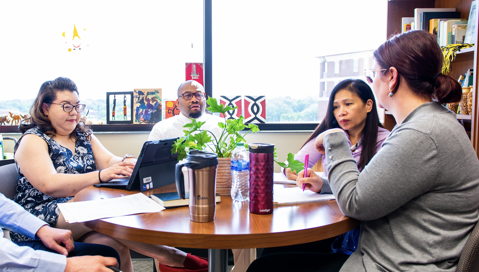 CPS team members in department meeting.