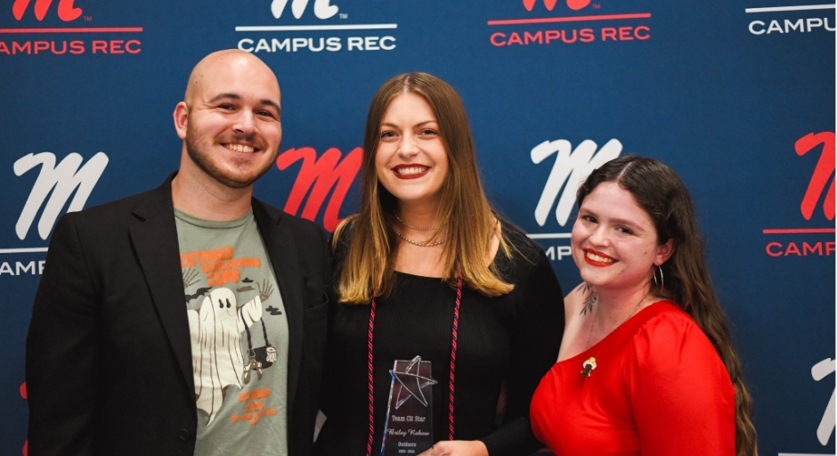 Student employee receiving award.