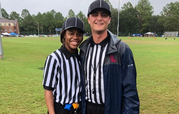 Two student flag football officials.