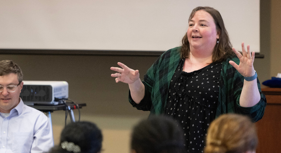 Liz Norell gesturing while speaking at a CETL workshop, with attendees in the foreground