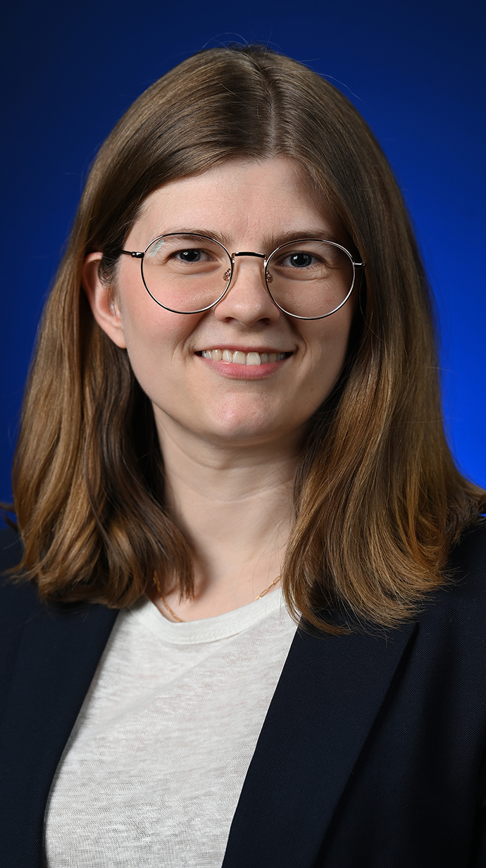 Headshot of a woman wearing glasses.