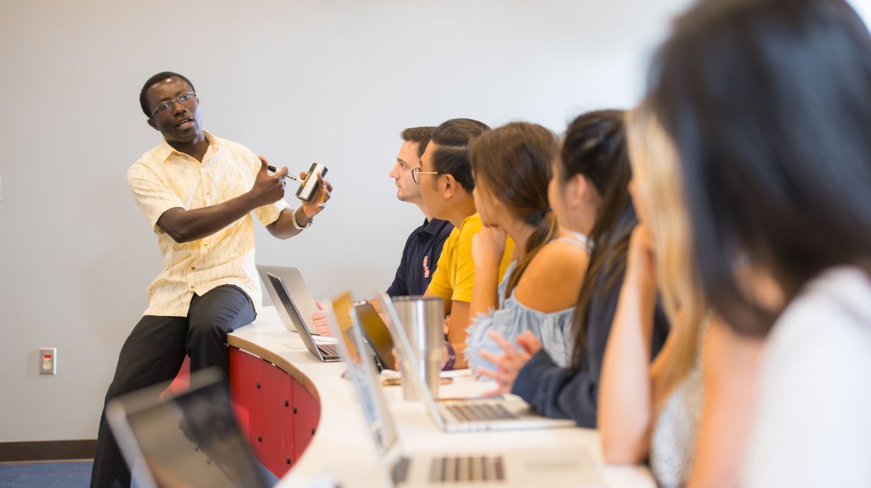 Bachelor of Science in Law Studies professor teaching class to a diverse group of students.