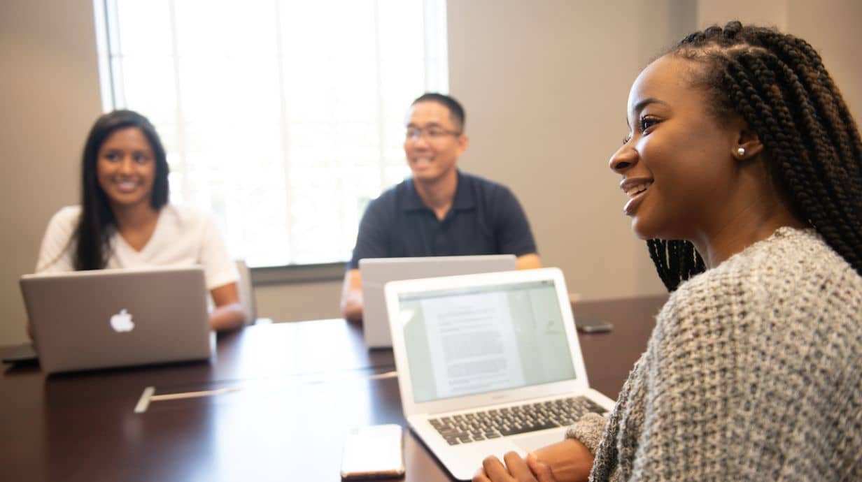 Master of Science in Criminal Justice graduate talks to community members. 