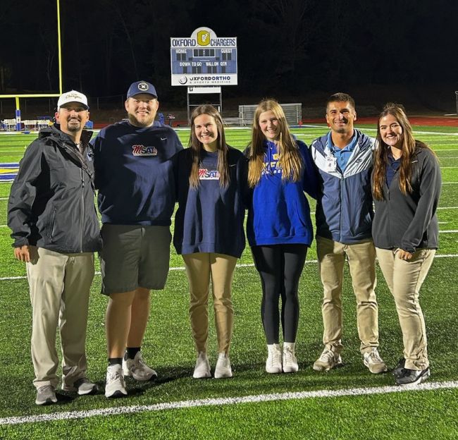 Tanner Hunter poses on the Oxford football field after a big win.