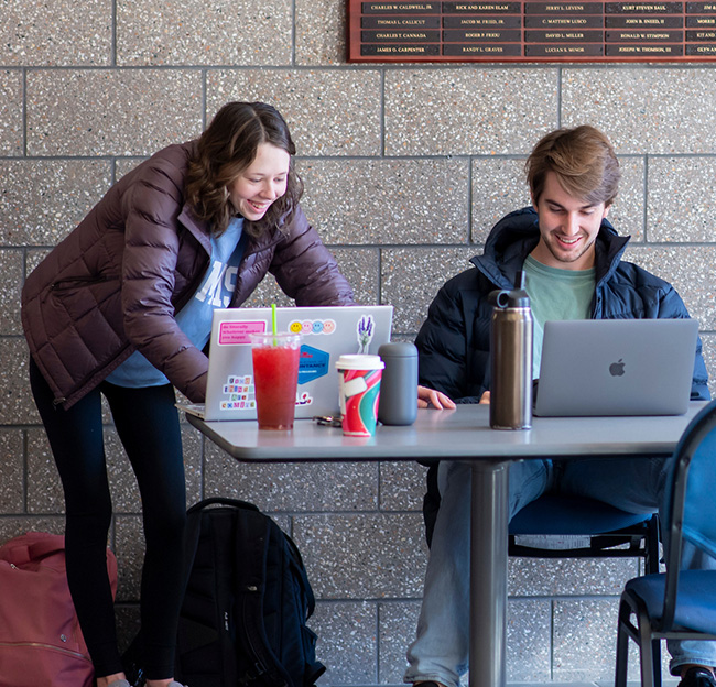 Two Ole Miss students studying together in a common area.