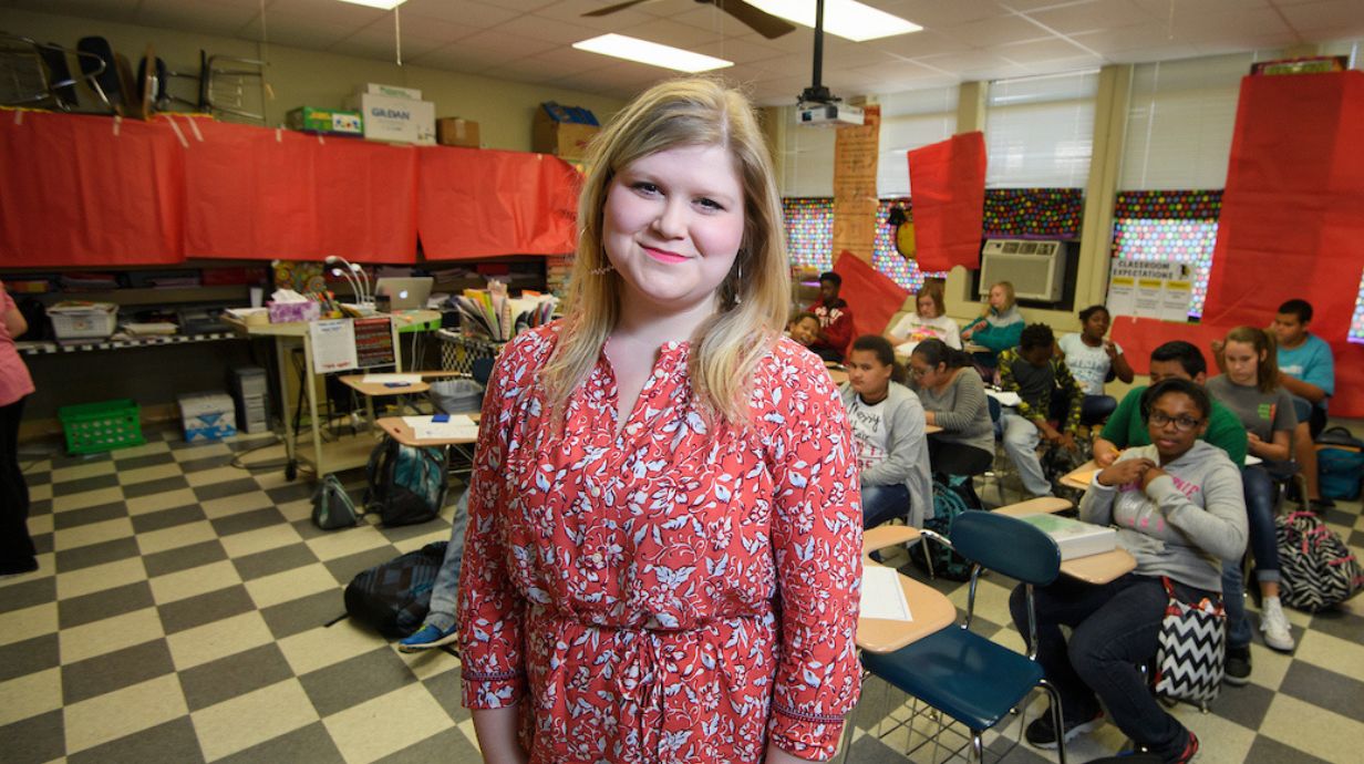 Gifted Certificate online - teacher poses in front of classroom