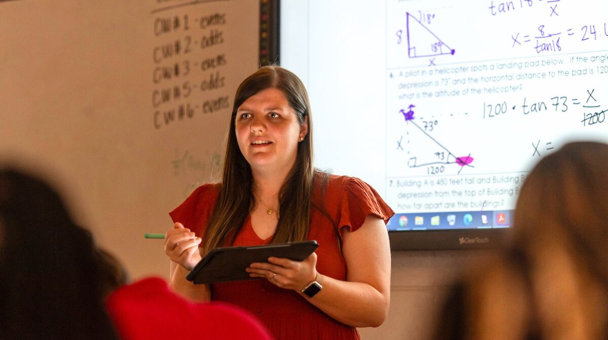 Master of Education (M.Ed.) in Secondary Education - teacher speaks in front of a classroom.